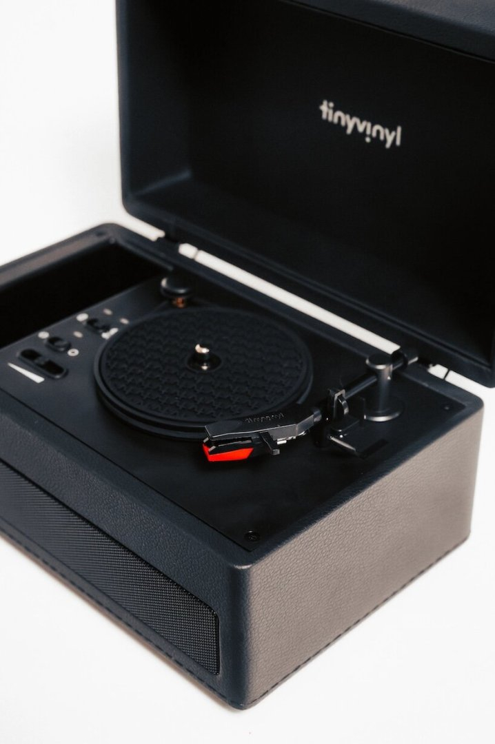 tiny vinyl player spins four-inch records on a miniature turntable - 4