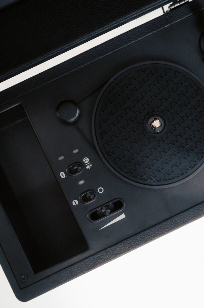 tiny vinyl player spins four-inch records on a miniature turntable - 5